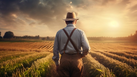 A farmer in a field of crops, representing the agricultural segment of the company.