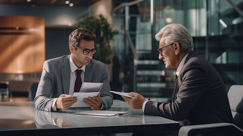 An executive in a smart suit discussing a new financial product with an older customer.
