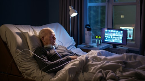 A patient at home using a compact console for on-demand dialysate production.