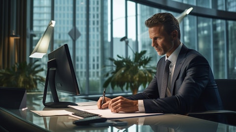 An executive of the regional bank, working at his desk in a modern office building.