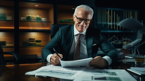 A portrait of a successful businessman looking up with confidence and optimism, surrounded by financial reports.