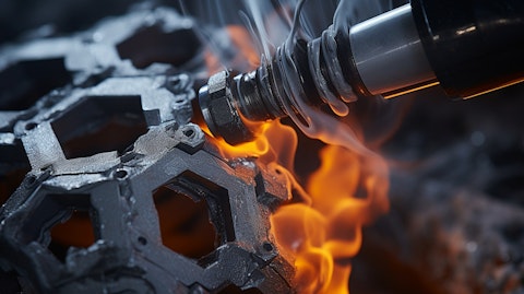 A close up of a carbon-based solution as it gets released from a nozzle into a mould.