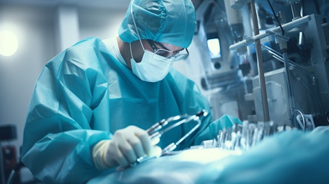 A cutting edge medical device in a sterile surgical setting, being operated by a skilled surgeon.