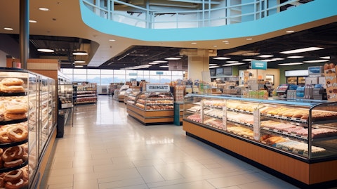 A bustling retail supermarket, stocked with a variety of frozen beverages, soft pretzels, and donuts.
