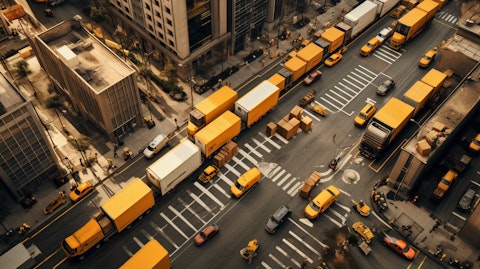 An aerial view of a bustling urban center with delivery vehicles crisscrossing the streets.