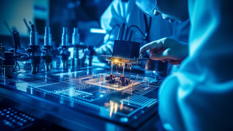 Technicians testing a microelectromechanical systems device for accuracy.