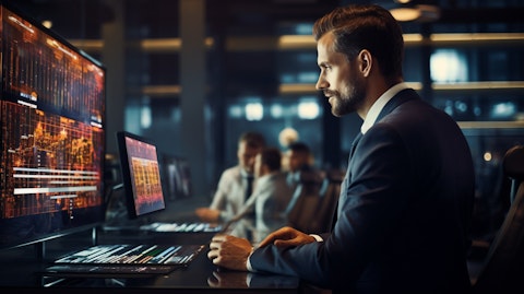 A business executive working with a customer at a sleek digital console.