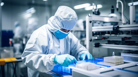 An engineer in a factory floor building advanced semiconductor packaging.