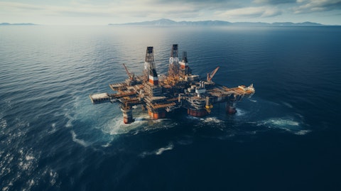 An aerial view of a large oil rig located in the ocean.