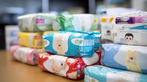 A close up of different packs of diapers and wipes, demonstrating the company's main product range.