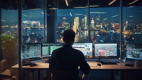 An employee working in a modern office space, overseeing software-as-a-service solutions.