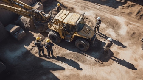 A bird's eye view of a team in protective gear operating heavy machinery in a silver extraction site.