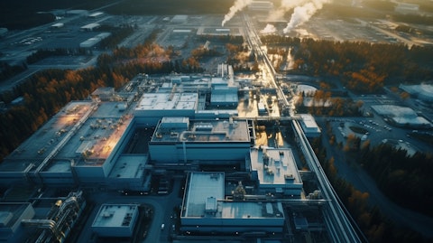 An aerial view of a large manufacturing facility, conveying the scale of the industrial processing.
