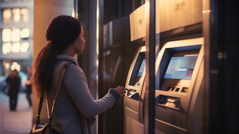 A woman inserting a check into a bank's deposit machine, demonstrating the company's checking and savings accounts services.