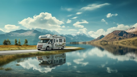 A scenic view of a lake with a recreational vehicle speeding across its surface.