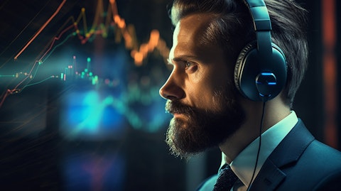 A business analyst with a headset examining data to identify potential fraud and abuse.