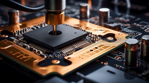 A close-up view of an electronic component being installed on a PCB.