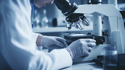 A Biote-certified practitioner examining a patient's blood sample under a microscope.