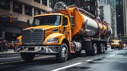 A long, winding concrete pump truck navigating a busy city street.