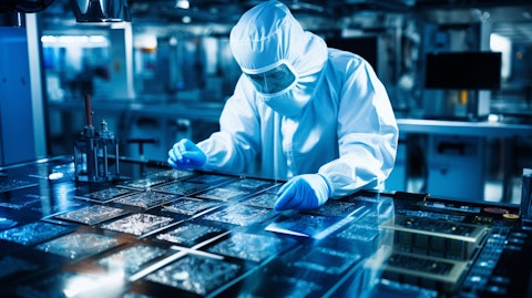 A technician inspecting a microchip with advanced technology used in the semiconductor industry.