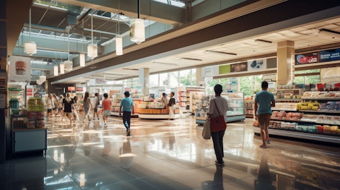 People strolling through a grocery-anchored shopping center.