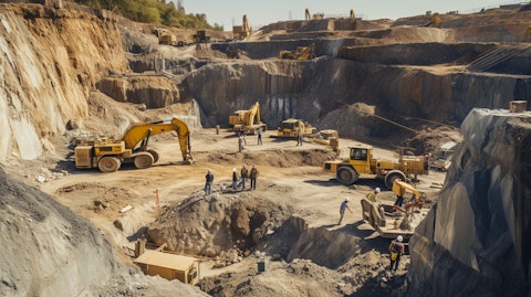 Aerial view of miners extracting precious metal deposits in a quarry.