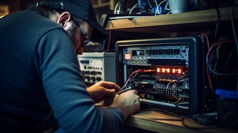 A technician testing a consumer's home device connected to the telecom service.