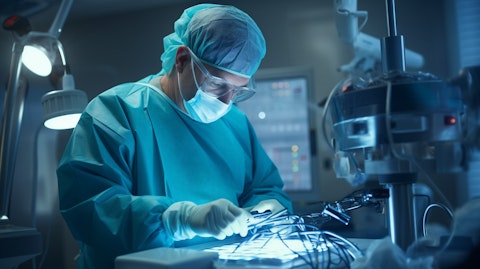A medical device technician calibrating a device in an operating room.