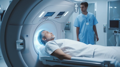 A medical professional using a magnetic resonance imaging (MRI) system to diagnose a patient in a hospital setting.