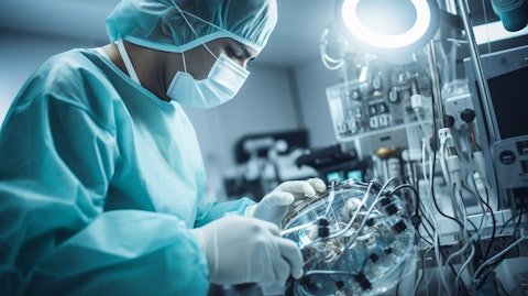 A technician assembling a Senhance Surgical System, illustrating the precision of medical robotics.