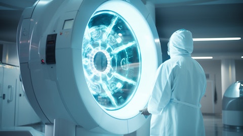 A medical technician in a lab coat overseeing a radiation therapy device.