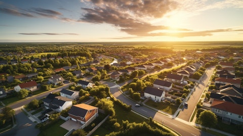 An aerial view of a suburban community, with residential homes stretching into the horizon.