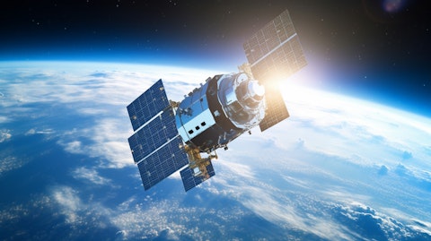 A satellite in orbit against a blue sky, displaying the power of the company's space-based systems.