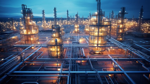 An aerial view of a petrochemical manufacturing plant, its intricate network of pipes and vats reflecting the industry's innovation and complexity.