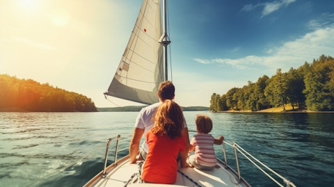 A family on a beautiful day sailing on a recreational boat in a peaceful lake.