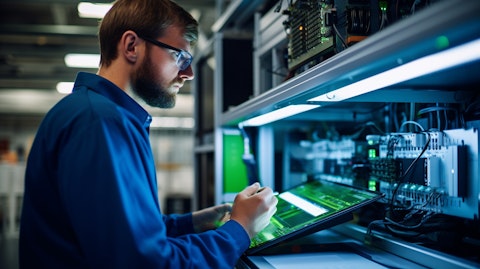 A technician in a laboratory, working with components of the Eos Znyth DC battery system.