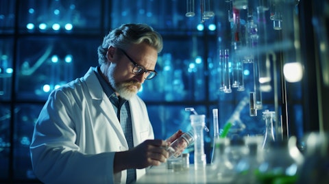 A biopharmaceutical scientist in a lab coat, working with test tubes in a lab environment.