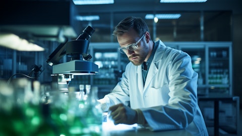 A scientist in a lab, focused on a molecular microscope with biologic drug candidates.