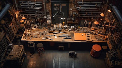 An overhead aerial shot of a gunsmiths workshop, surrounded by tools of the trade.