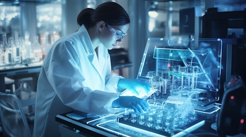 A laboratory technician using high tech equipment to sequence cancer genomics.