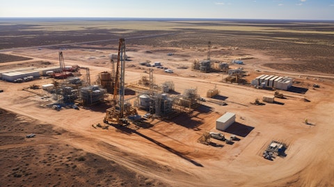 An aerial view of drilling rigs and gas pipelines in West Texas, revealing the company's operations.