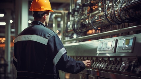 A worker inspecting a chemical process control system at a general industrial facility.
