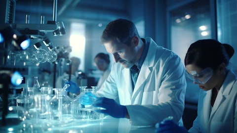 A group of medical professionals in a laboratory environment, examining a biopharmaceutical drug candidate.