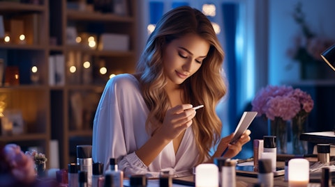 A beautiful woman applying makeup with grooming products from the company.