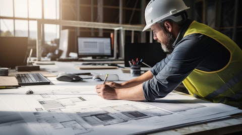 A close-up of a construction worker installing an electrochromic glass panel, showing the company's focus on modern building products.
