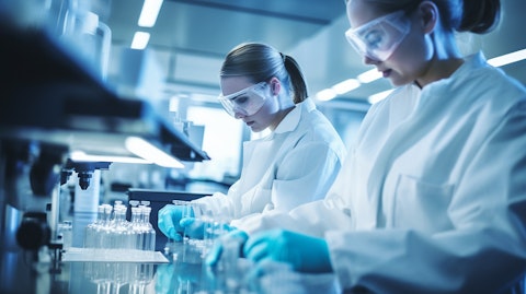 Scientific researchers in laboratory coats working on a biopharmaceutical project.