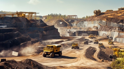 Large scale mining machinery operating in a quarry, showing the vast operations of the company's mining units.