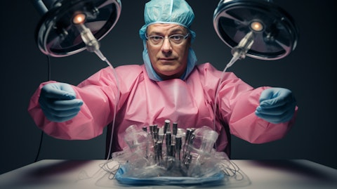 A medical practitioner wearing gloves and performing a fat transfer operation.