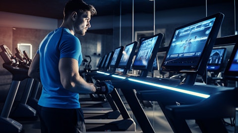 A person in a fitness studio, demonstrating the latest workout routine powered by the company.