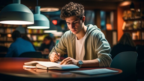 A student studying English language learning materials in a modern learning environment.